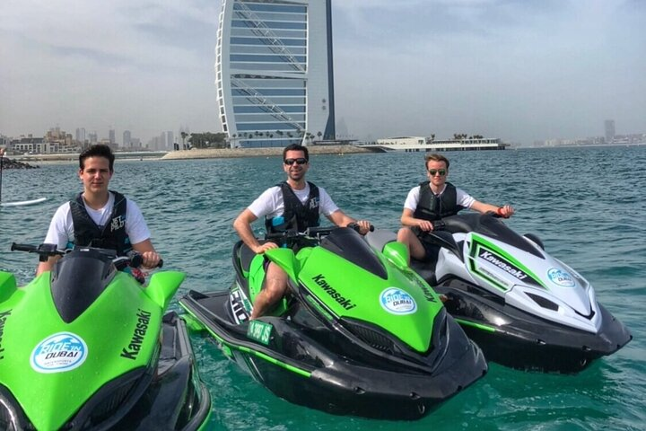 Race across the stunning waters of Dubai zooming past iconic landmarks like the Burj Al Arab and Palm Islands creating unforgettable memories in this exhilarating jet ski adventure.